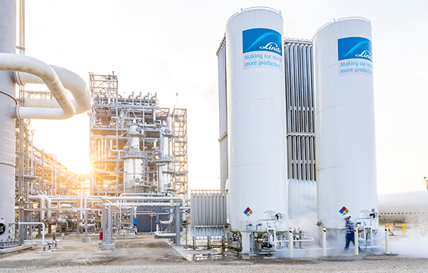 Gas plant and gas tanks at sunset