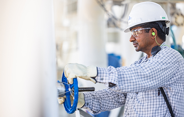 Employee working on a gas plant