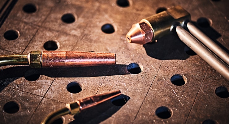 Abbildung verschiedener Brennerköpfe auf Werkbank